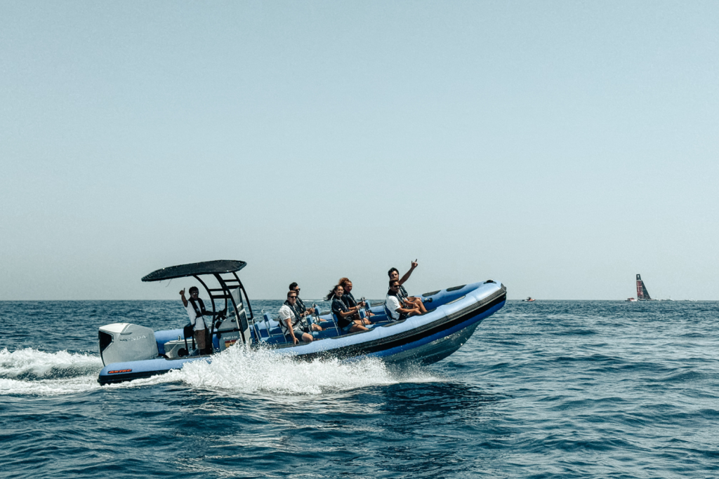 The Astec PB800 rigid inflatable boat floating on the water, showcasing its sturdy design, stability, and high performance for navigation.